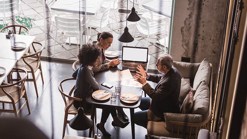 Businesspeople Having Meeting In A Restaurant