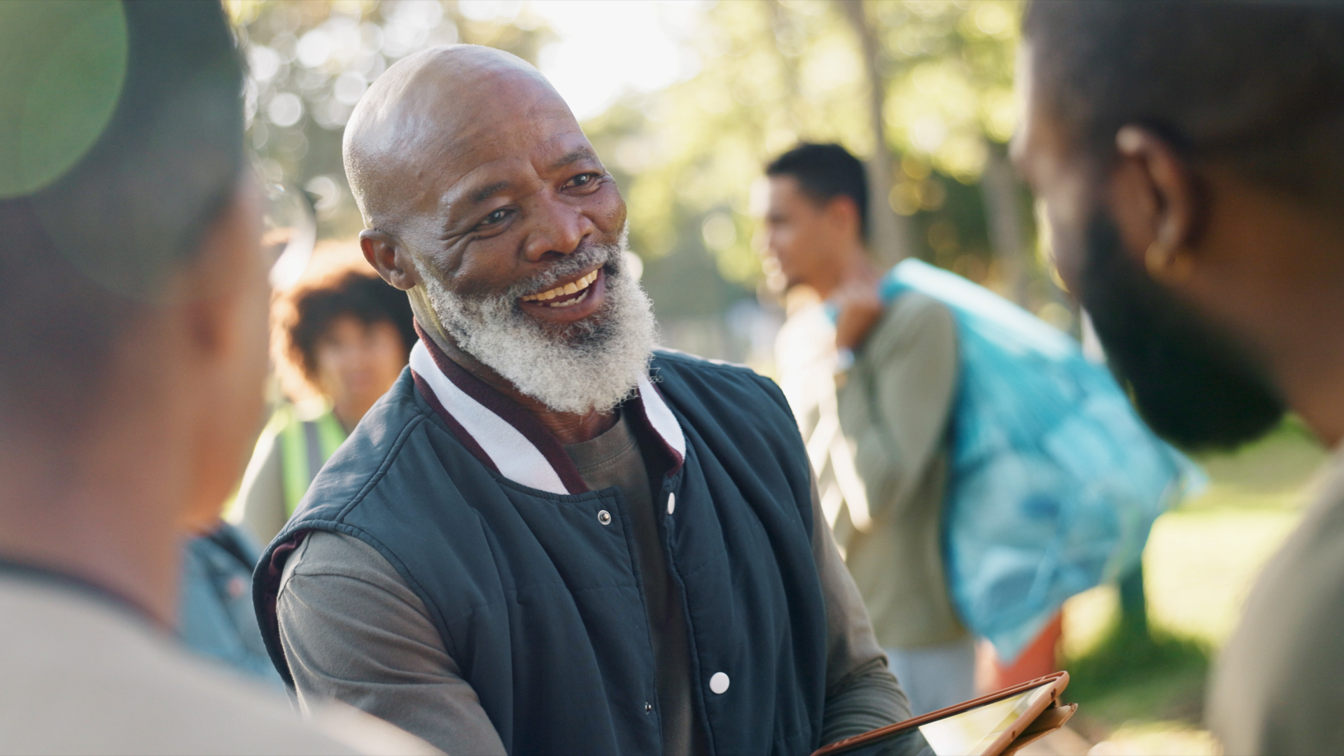 Man in park at nonprofit event.